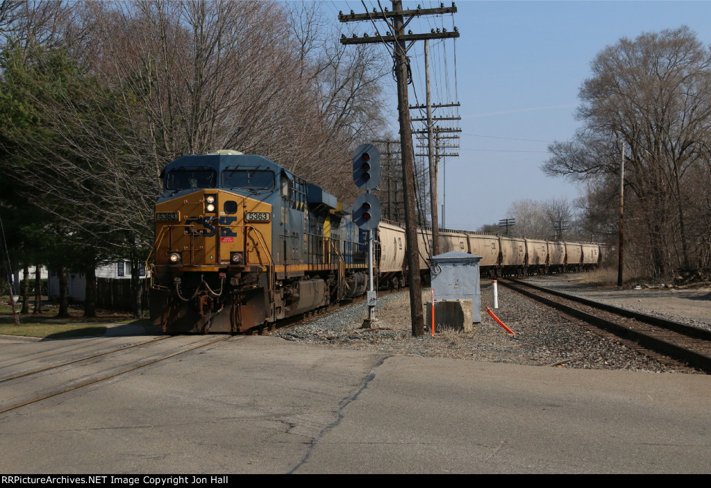 Coming across the old GTW, LSRC's Y117 crew rolls north on the Saginaw Sub with an empty grain train